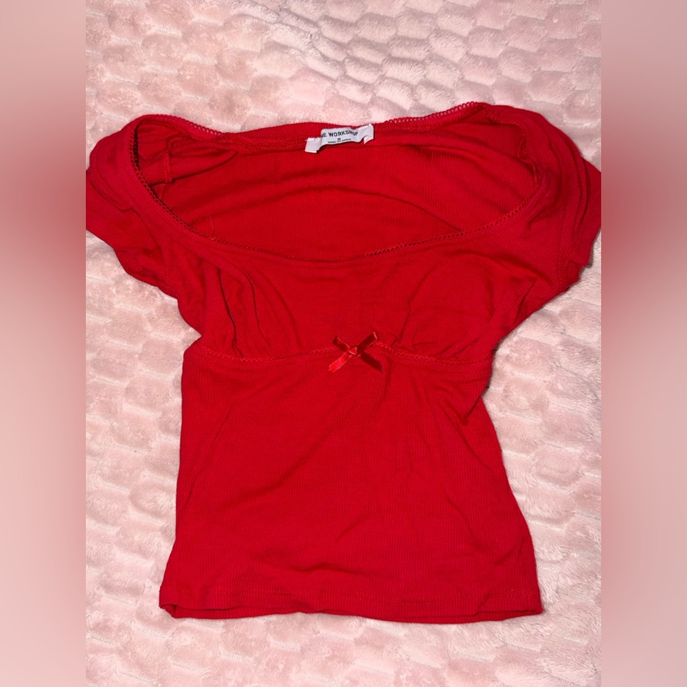 Red ribbed full-length fitted top with bow detail and lace trim